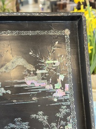 A rare large square Chinese laque burgaut&eacute; tray depicting a mountainous garden, Kangxi