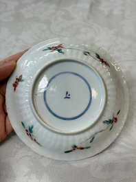 Four Chinese famille verte cups and seven saucers, 19th C.
