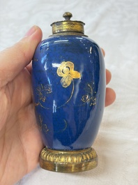A Chinese powder-blue-ground gilt-decorated spittoon and two gilt-bronze-mounted vases, 18th C.