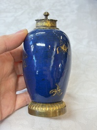 A Chinese powder-blue-ground gilt-decorated spittoon and two gilt-bronze-mounted vases, 18th C.