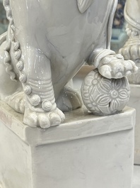 A pair of large Chinese Dehua blanc de Chine buddhist lion joss stick holders, 19th C.