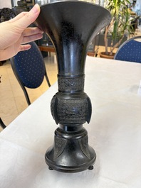 A pair of Chinese archaistic bronze 'Gu' vases, 18th C.