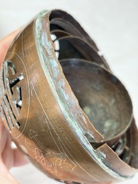 A Chinese or Vietnamese silver-inlaid copper reticulated spherical censer and a silver- and copper-inlaid bronze tripod censer, 19th C.