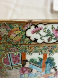 A pair of Chinese Canton famille rose hat stands, a covered vase, a vase and a bowl, 19th C.