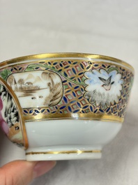 A pair of Chinese Canton famille rose cups and saucers with figural design, Daoguang