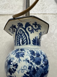 A pair of blue and white Dutch Delft garlic-head vases mounted as lamps, 18th C.