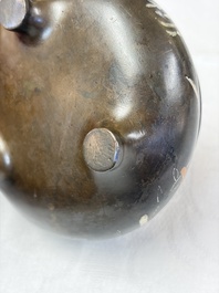 A Chinese or Vietnamese silver-inlaid copper reticulated spherical censer and a silver- and copper-inlaid bronze tripod censer, 19th C.