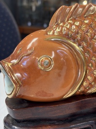 A pair of Chinese coral-red-glazed gilt-decorated 'Goldfish' wall pocket vases on wooden stands, Republic