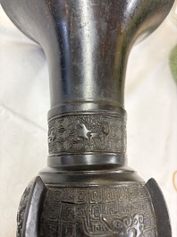 A pair of Chinese archaistic bronze 'Gu' vases, 18th C.