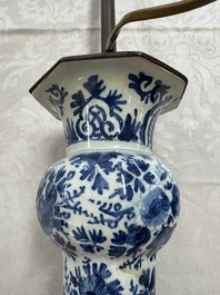 A pair of blue and white Dutch Delft garlic-head vases mounted as lamps, 18th C.