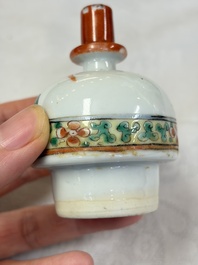 A Chinese famille rose spittoon, a famille verte covered double-gourd vase and a gilt-decorated coral-red-ground hat stand, Daoguang mark, 19th C.