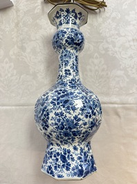 A pair of blue and white Dutch Delft garlic-head vases mounted as lamps, 18th C.