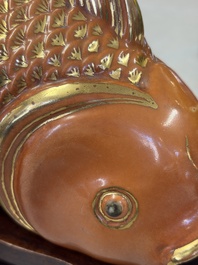 A pair of Chinese coral-red-glazed gilt-decorated 'Goldfish' wall pocket vases on wooden stands, Republic