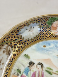 A pair of Chinese Canton famille rose cups and saucers with figural design, Daoguang