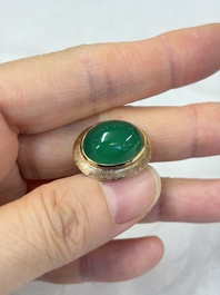 A pair of 18kt yellow gold cufflinks with green cabochon stones, 20th C.