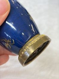 A Chinese powder-blue-ground gilt-decorated spittoon and two gilt-bronze-mounted vases, 18th C.