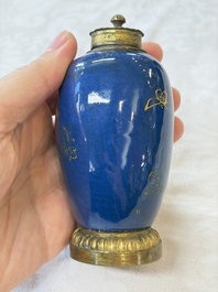 A Chinese powder-blue-ground gilt-decorated spittoon and two gilt-bronze-mounted vases, 18th C.