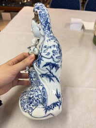A Chinese blue and white 'Guanyin and child' group, Qianlong