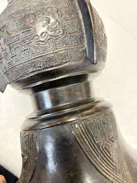 A pair of Chinese archaistic bronze 'Gu' vases, 18th C.