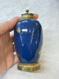 A Chinese powder-blue-ground gilt-decorated spittoon and two gilt-bronze-mounted vases, 18th C.
