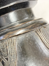 A pair of Chinese archaistic bronze 'Gu' vases, 18th C.