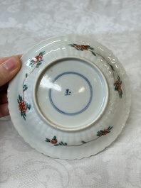 Four Chinese famille verte cups and seven saucers, 19th C.