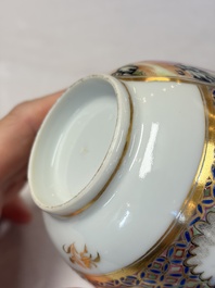 A pair of Chinese Canton famille rose cups and saucers with figural design, Daoguang