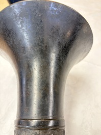 A pair of Chinese archaistic bronze 'Gu' vases, 18th C.