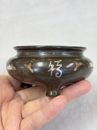 A Chinese or Vietnamese silver-inlaid copper reticulated spherical censer and a silver- and copper-inlaid bronze tripod censer, 19th C.