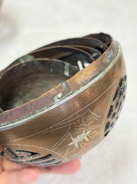 A Chinese or Vietnamese silver-inlaid copper reticulated spherical censer and a silver- and copper-inlaid bronze tripod censer, 19th C.