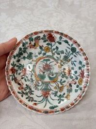 Four Chinese famille verte cups and seven saucers, 19th C.