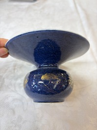 A Chinese powder-blue-ground gilt-decorated spittoon and two gilt-bronze-mounted vases, 18th C.