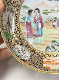 A pair of Chinese Canton famille rose cups and saucers with figural design, Daoguang