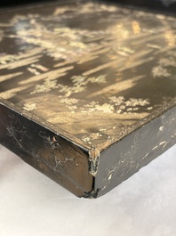 A rare large square Chinese laque burgaut&eacute; tray depicting a mountainous garden, Kangxi