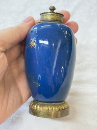A Chinese powder-blue-ground gilt-decorated spittoon and two gilt-bronze-mounted vases, 18th C.