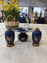 A Chinese powder-blue-ground gilt-decorated spittoon and two gilt-bronze-mounted vases, 18th C.
