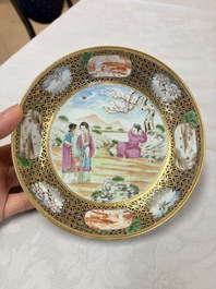 A pair of Chinese Canton famille rose cups and saucers with figural design, Daoguang