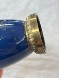 A Chinese powder-blue-ground gilt-decorated spittoon and two gilt-bronze-mounted vases, 18th C.