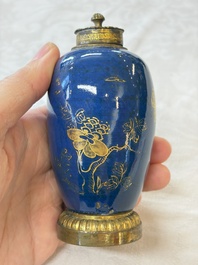 A Chinese powder-blue-ground gilt-decorated spittoon and two gilt-bronze-mounted vases, 18th C.