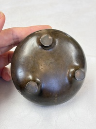 A Chinese or Vietnamese silver-inlaid copper reticulated spherical censer and a silver- and copper-inlaid bronze tripod censer, 19th C.