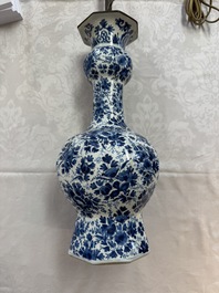 A pair of blue and white Dutch Delft garlic-head vases mounted as lamps, 18th C.