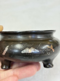 A Chinese or Vietnamese silver-inlaid copper reticulated spherical censer and a silver- and copper-inlaid bronze tripod censer, 19th C.