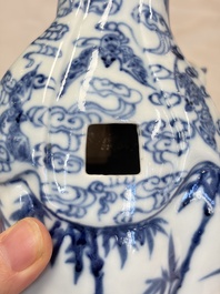 A Chinese blue and white 'Guanyin and child' group, Qianlong