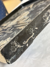 A rare large square Chinese laque burgaut&eacute; tray depicting a mountainous garden, Kangxi