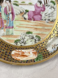 A pair of Chinese Canton famille rose cups and saucers with figural design, Daoguang