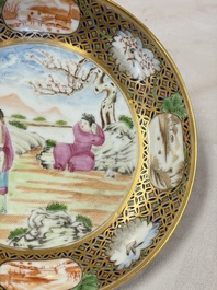 A pair of Chinese Canton famille rose cups and saucers with figural design, Daoguang