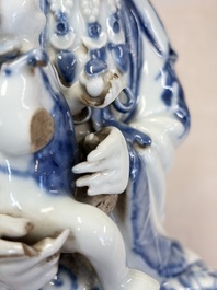 A Chinese blue and white 'Guanyin and child' group, Qianlong