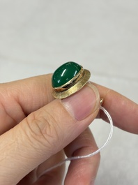 A pair of 18kt yellow gold cufflinks with green cabochon stones, 20th C.