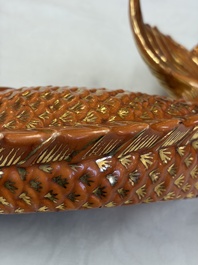 A pair of Chinese coral-red-glazed gilt-decorated 'Goldfish' wall pocket vases on wooden stands, Republic