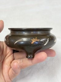 A Chinese or Vietnamese silver-inlaid copper reticulated spherical censer and a silver- and copper-inlaid bronze tripod censer, 19th C.